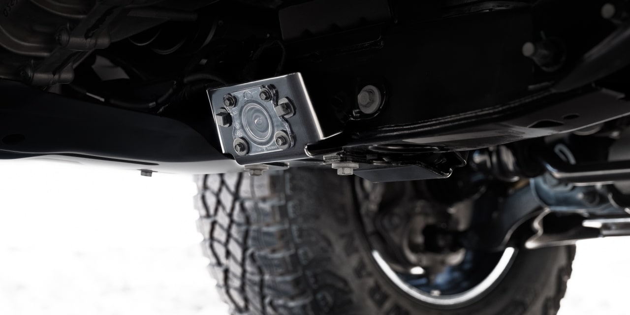 The Underside of a 2027 GMC Canyon Showing Off-Road Suspension Components and a Tire