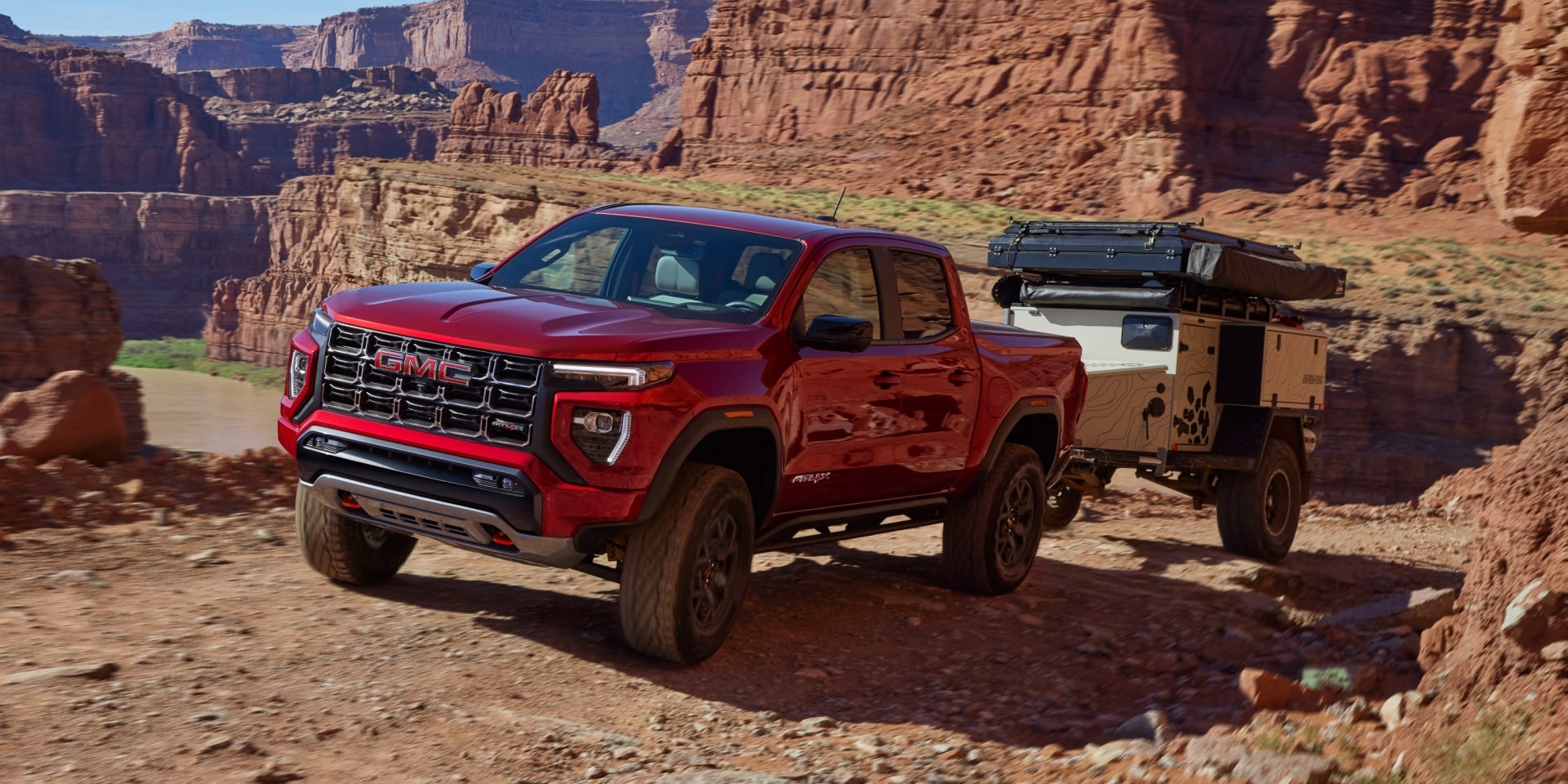 An Infotainment Screen Displaying a Side Camera View with a Trailer Attached to the 2027 GMC Canyon