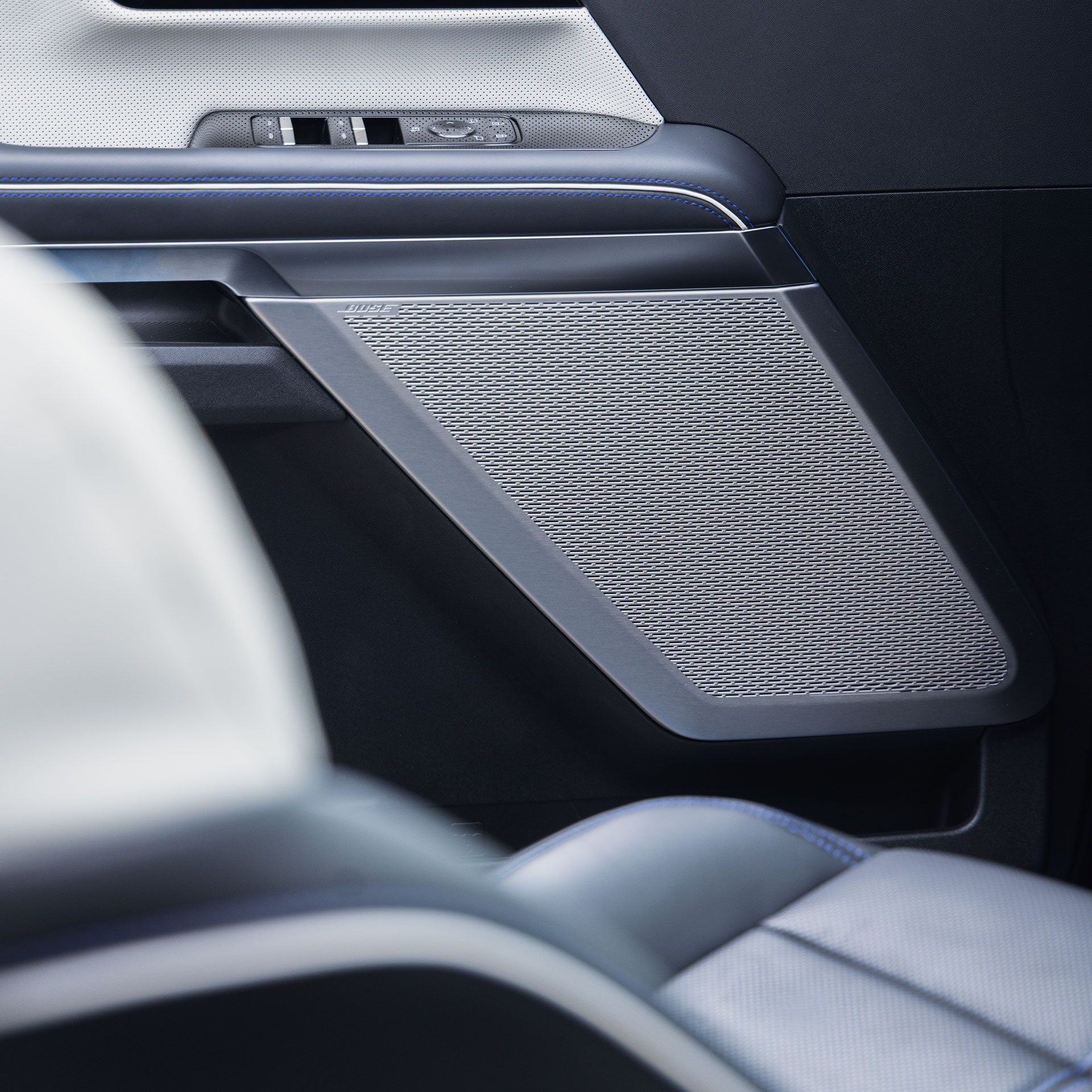 A Detailed View of the Speaker Grille and Door Panel in the Interior of the GMC Sierra 1500