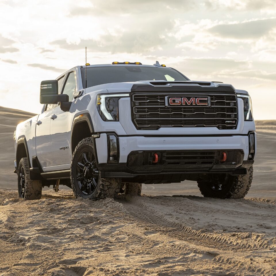 The White GMC Sierra HD Driving Uphill