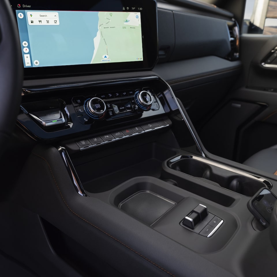 Closeup on the Center Console, Infotainment System, and Cupholders on the GMC Sierra HD