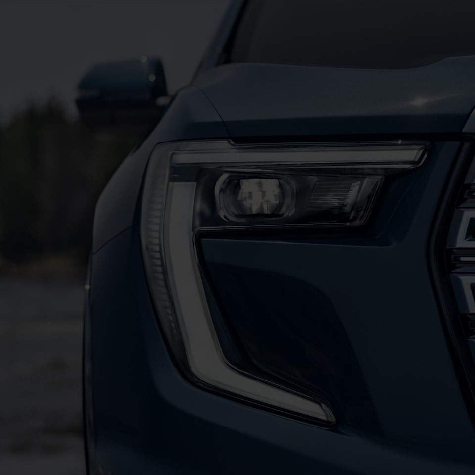 A Close-Up on the Exterior Headlight on the 2024 GMC Acadia