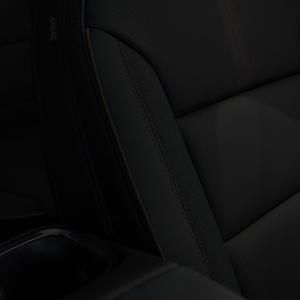A Close-Up on the Stitched Black Leather Interior Seating on the 2024 GMC Acadia 