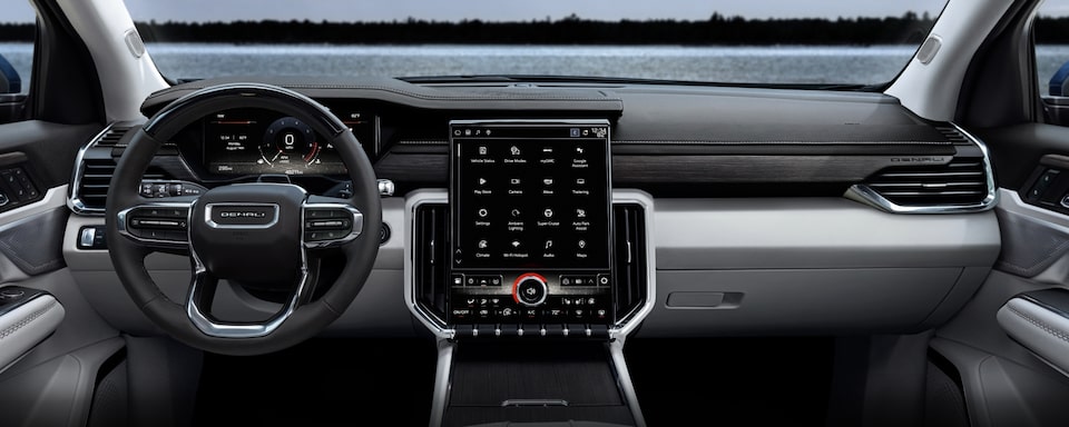 A Rear Passenger's View of the Front Interior on the 2024 GMC Acadia Denali