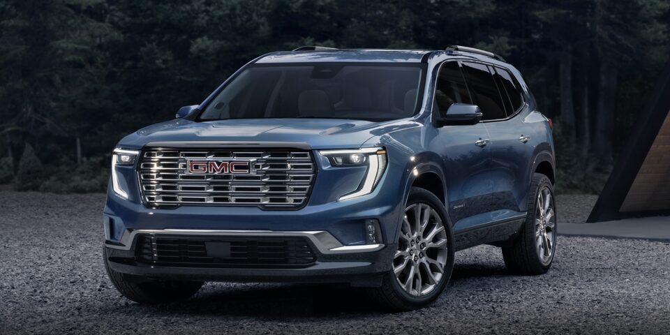 The Parked Blue 2024 GMC Acadia Denali Parked Off-Road
