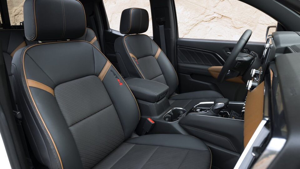 Closeup on the Stitched Front Seats and Cupholder of the New GMC Canyon AT4X