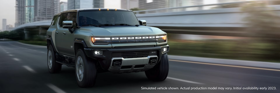 2023 GMC HUMMER EV electric SUV driving on expressway