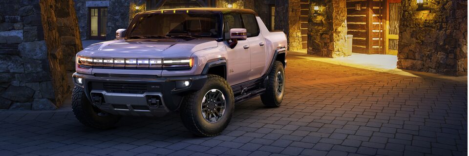 GMC HUMMER EV Parked in Front of House