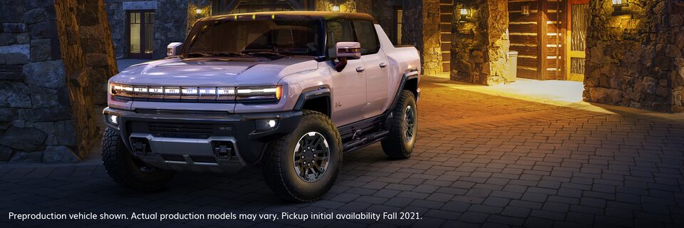 GMC HUMMER EV Parked in Front of House