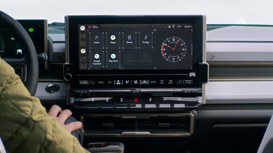 A Man Driving the GMC HUMMER EV and Utilizing the Super Cruise Enhancements