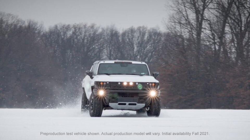GMC HUMMER EV Electric Truck Driving on snow