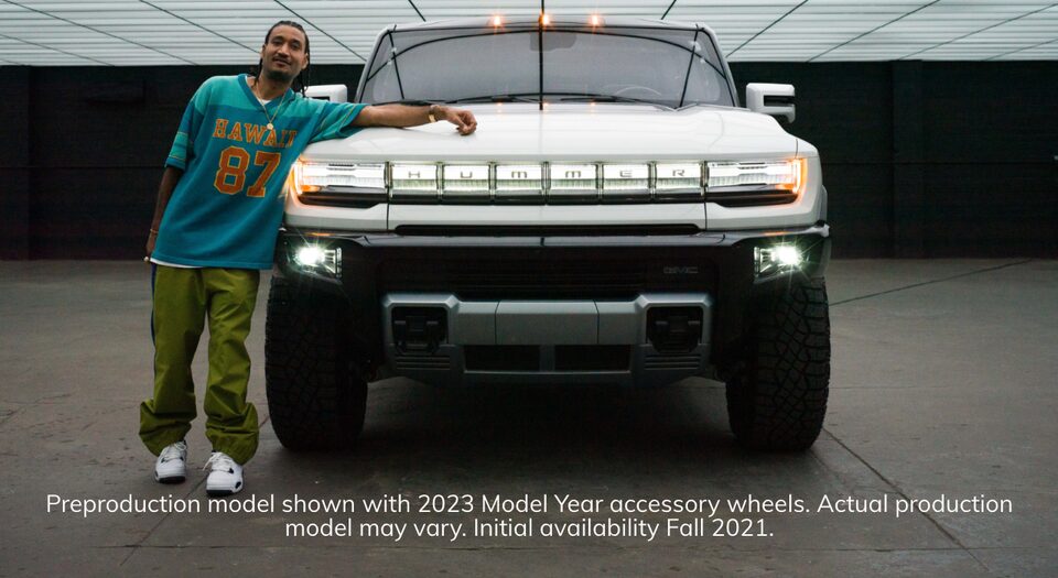 Designer Don C standing next to a 2023 GMC Hummer EV