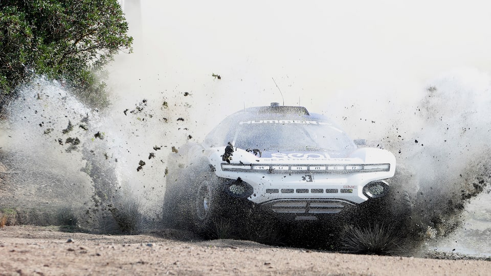 No. 99 SEGI TV GMC HUMMER EV.R Driving through Mud