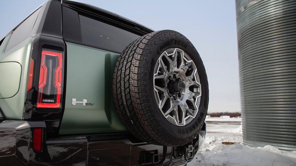 GMC HUMMER EV electric SUV swing gate close up