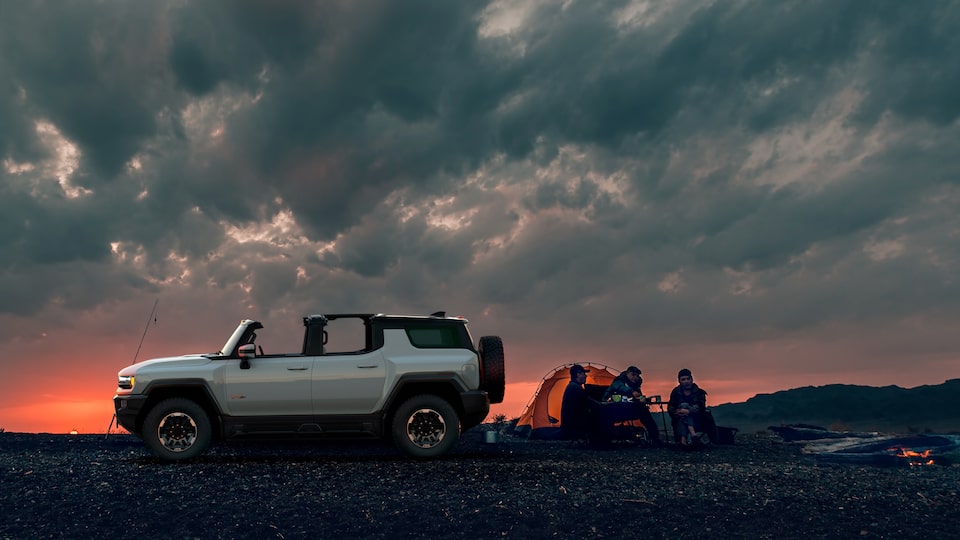 GMC HUMMER EV electric SUV at campsite