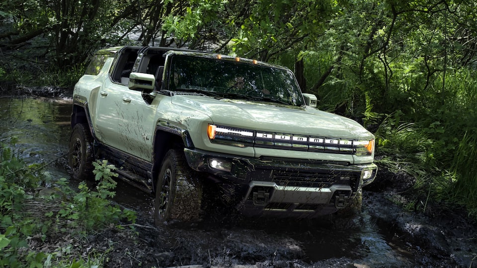 GMC HUMMER EV electric SUV driving off-road