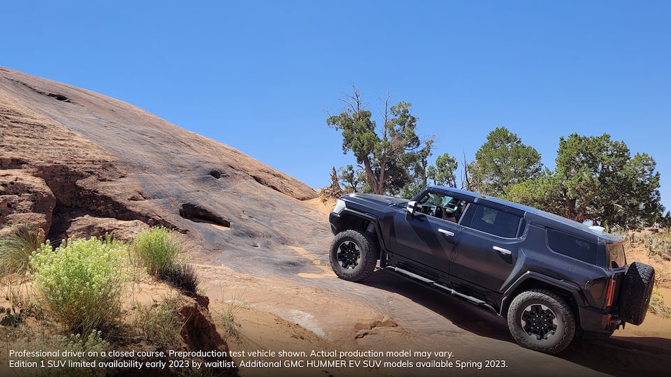 Side Profile View of the GMC HUMMER EV Driving up a Steep Incline with Ease