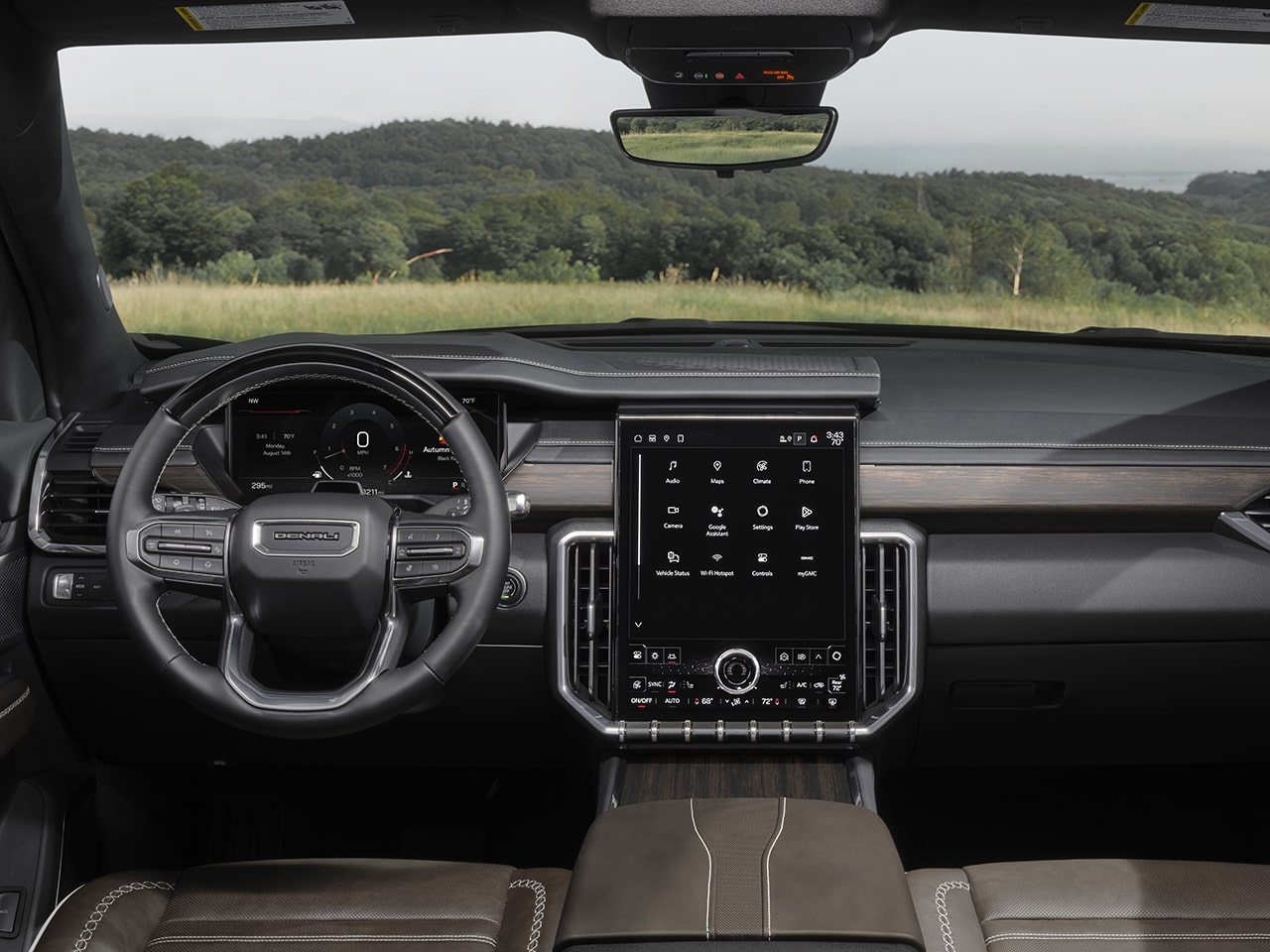 Interior View of the Dashboard, Steering Wheel, and Infotainment System in the 2026 GMC Acadia Denali Ultimate Luxury Mid-Size SUV