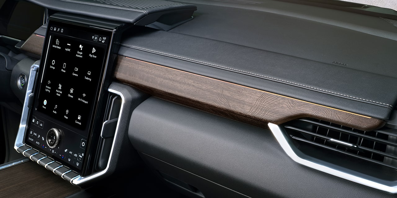 Close-up of the Premium Wood Trim on the Dashboard of the 2026 GMC Acadia Denali Ultimate Luxury Mid-Size SUV