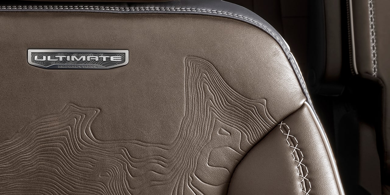 Close-up of the Ultimate Badging on the Full-Leather Seats in the 2026 GMC Acadia Denali Ultimate Luxury Mid-Size SUV