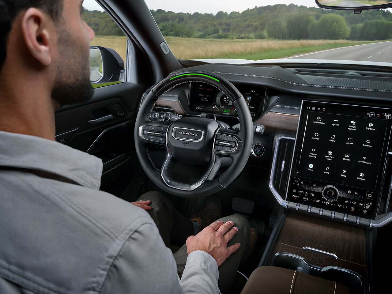 A Man Using Super Cruise Hands-Free Driving Technology in the 2026 GMC Acadia Denali Ultimate Luxury Mid-Size SUV