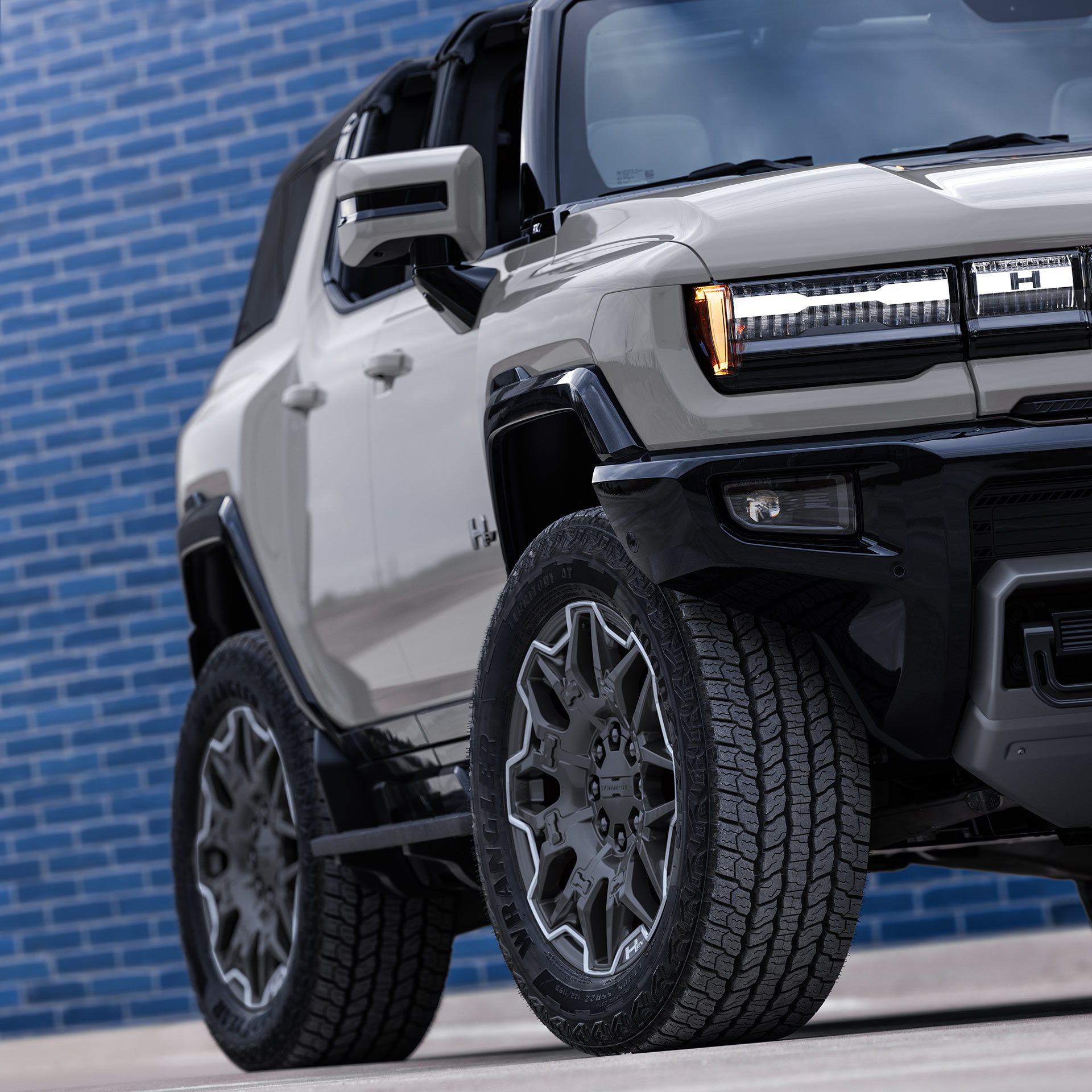 Front Side View of the 2026 GMC HUMMER EV SUV with the with the Infinity Roof Open