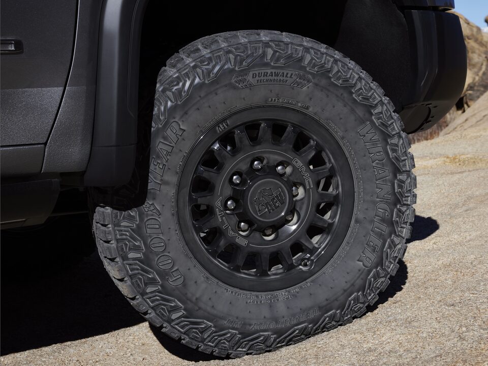Close-up on the Black Rim and Tire of the GMC Sierra HD AT4X