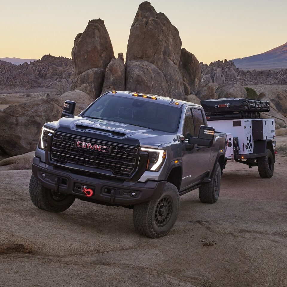 A New GMC Sierra HD AT4X Towing a Trailer Off-road