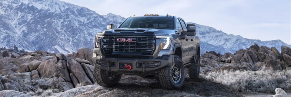The Powerful New GMC Sierra HD AT4X Parked Off-road on a Rock