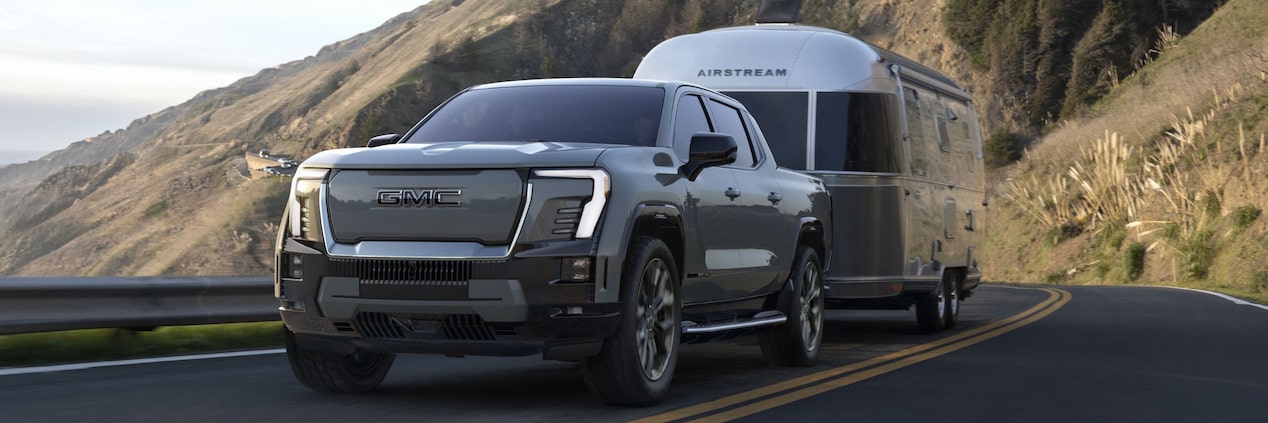  New upcoming Sierra EV Denali Edition1 towing a airstream through mountains