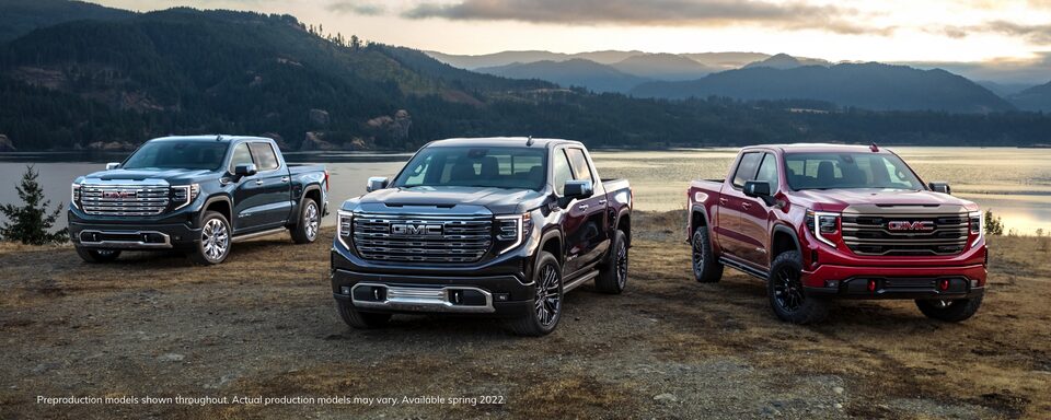 2022 GMC Sierra Pickup Truck Lineup in front of Mountains