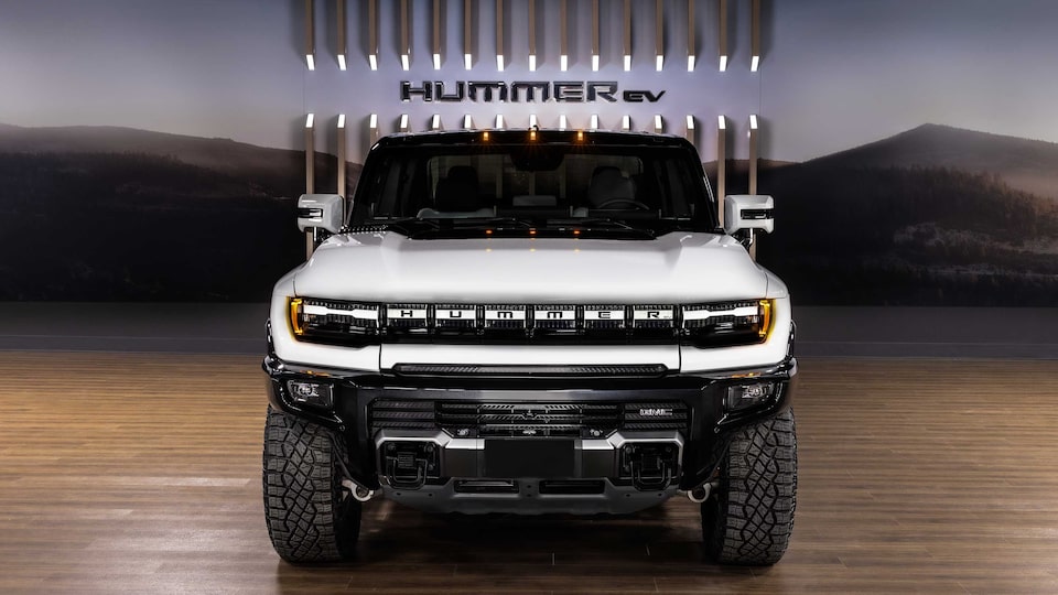 The Hummer EV SUV Speeding on an Open Expressway in the City 