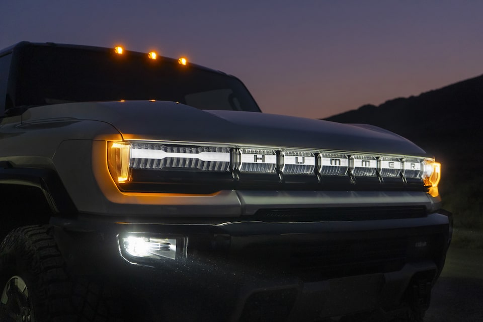 The Redesigned Front Grille of the Hummer EV During the Night