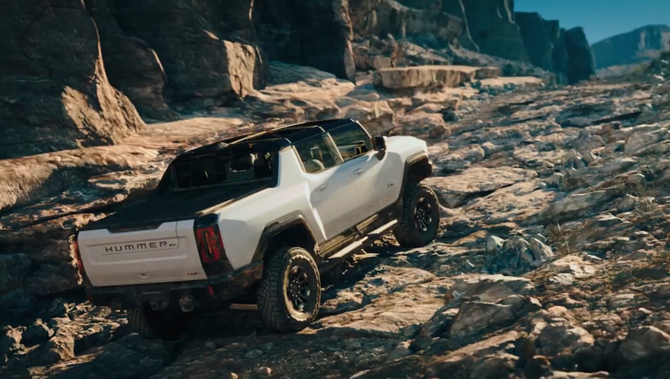 The Hummer EV Driving on a Steep Rocky Incline while Off-Roading