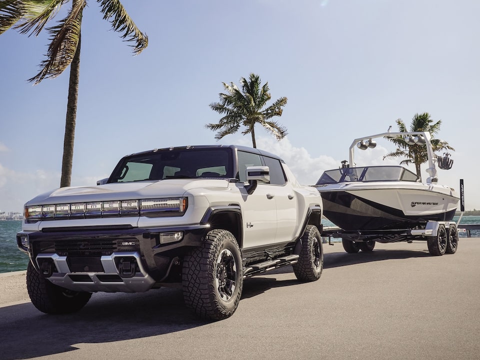 The Hummer EV Pickup Towing an Air Streamer on a Mountain Roadway 