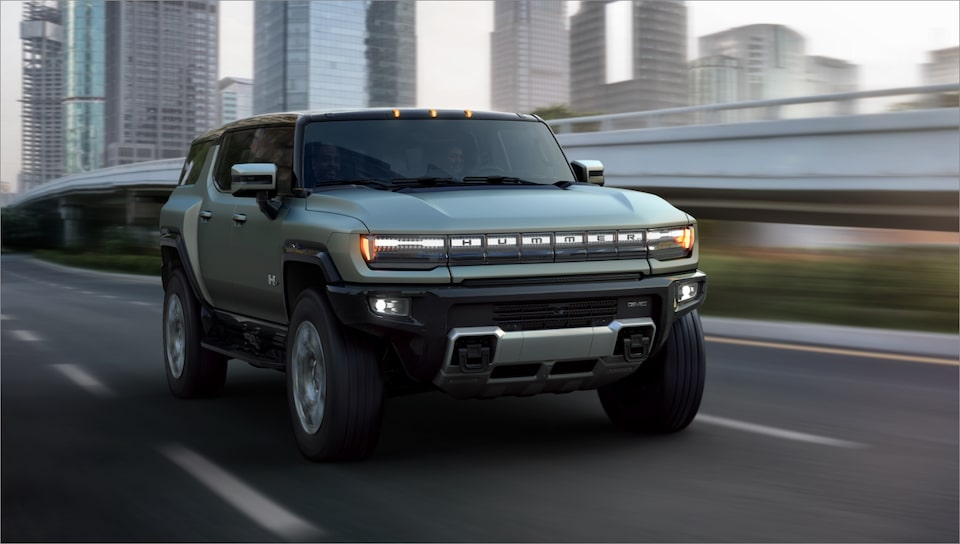 The Hummer EV SUV Speeding on an Open Expressway in the City