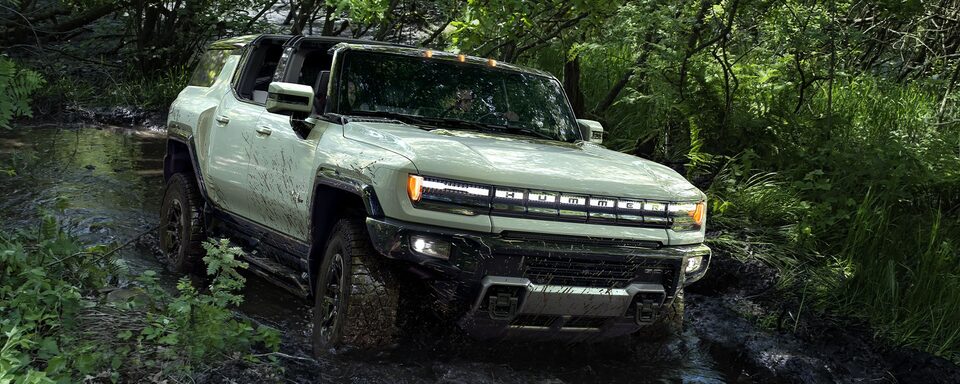 The Crab Walk Feature of the Hummer EV SUV Being Used in an Off-Road Woodland Trail