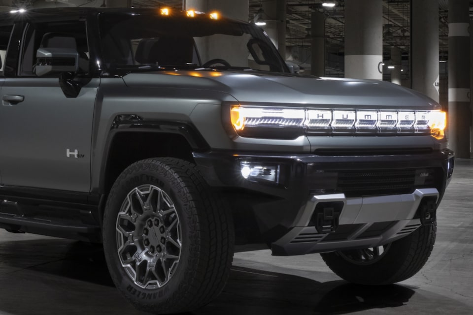 The Redesigned Front Grille of the Hummer EV SUV During the Night