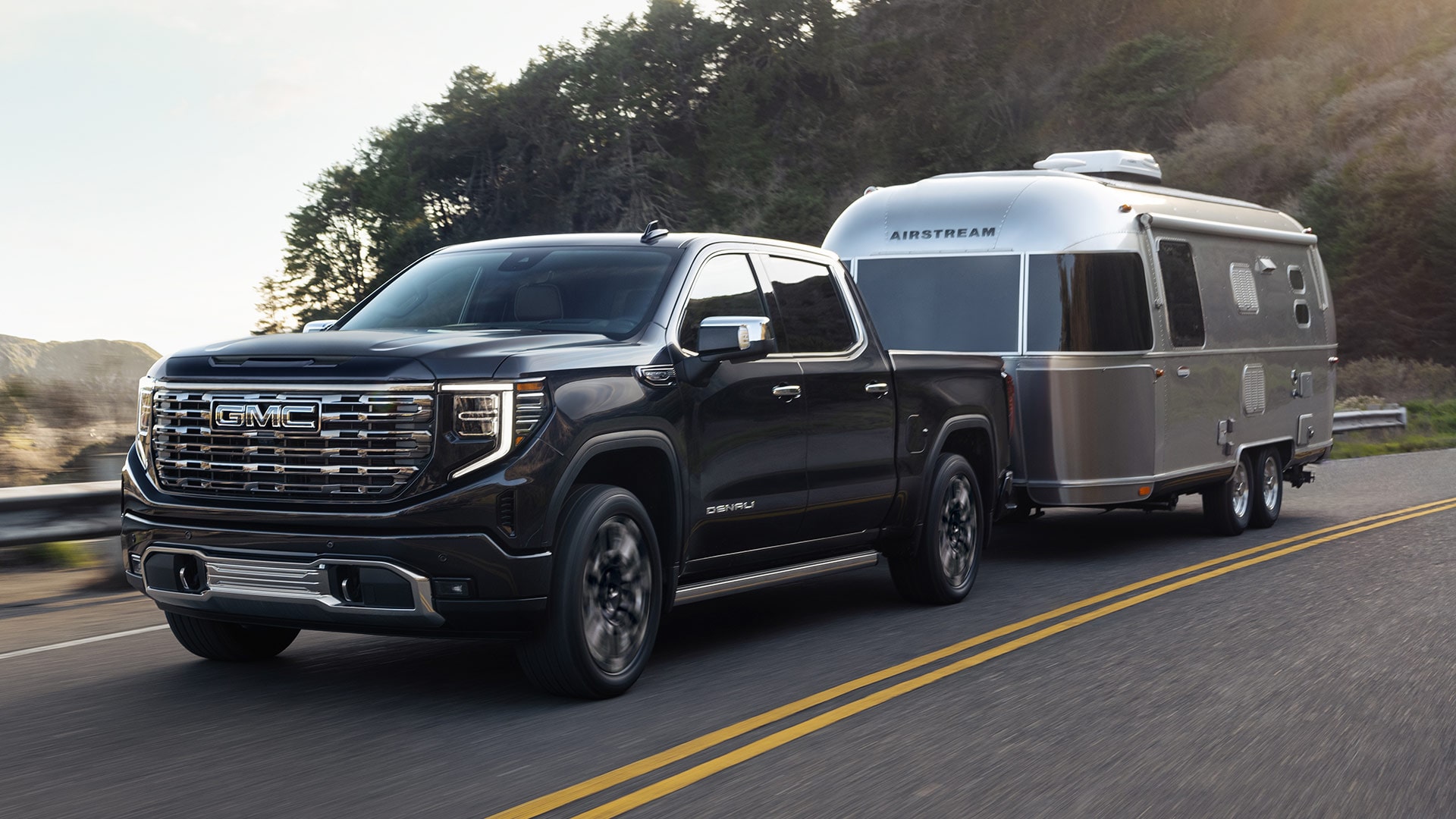 The GMC Sierra 1500 Pickup Truck Towing an Airstream RV Down the Open Road