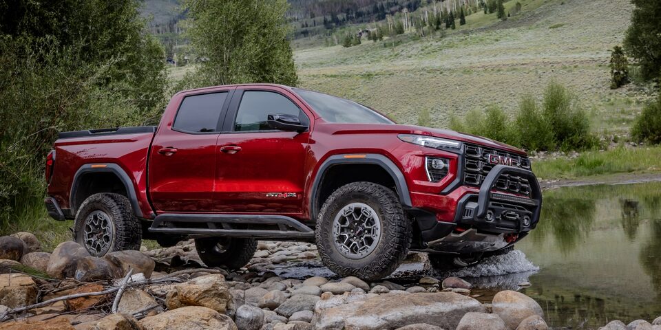 The New GMC Canyon AT4X Driving Off-Road On Large Rocks by Water