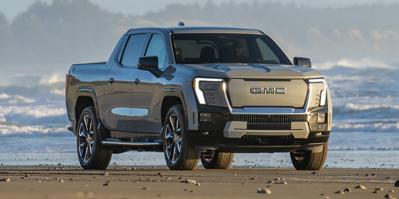 Front Three-Quarter View of the Sierra EV Pickup Truck Parked on the Beach