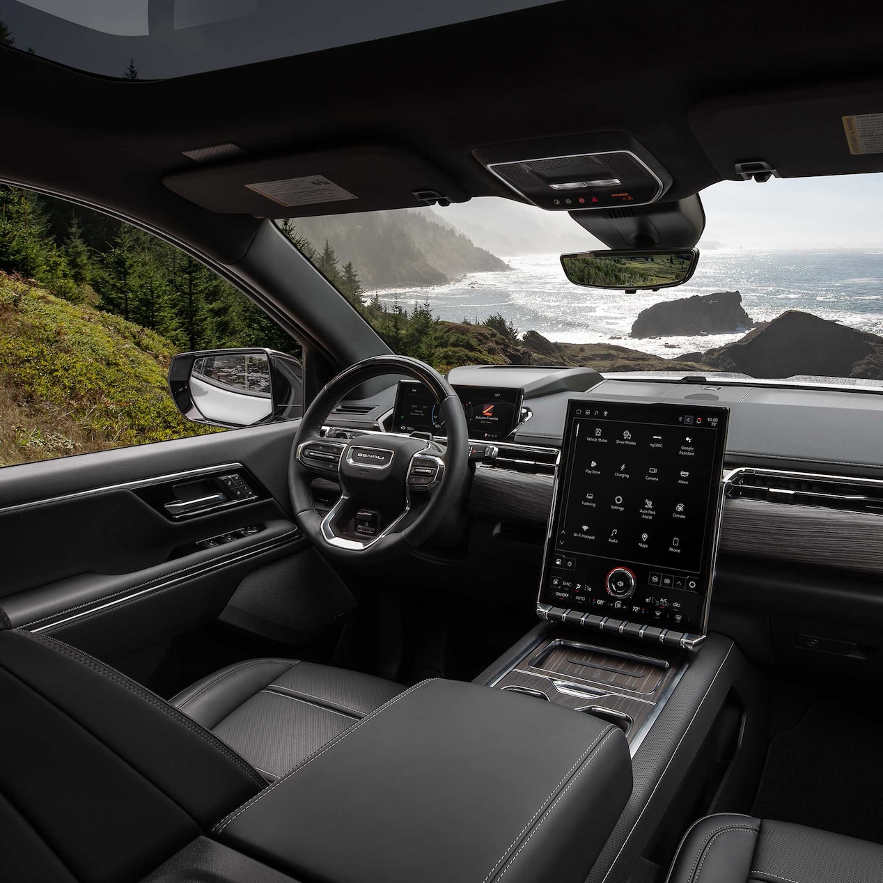 Interior View of the Steering Wheel and Infotainment Screen in the Sierra EV Pickup Truck