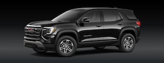 A Black GMC Terrain SUV Is Parked From a Front Three-Quarters Angle Against a Dark Background