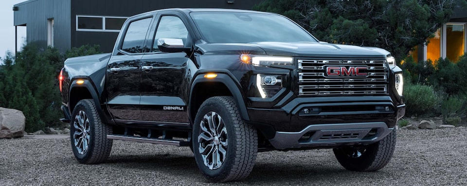 A Side Shot of the 2024 GMC Canyon Denali in Black Parked