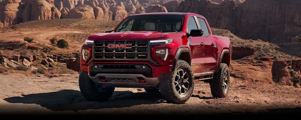 A Red GMC Canyon Parked in the Desert