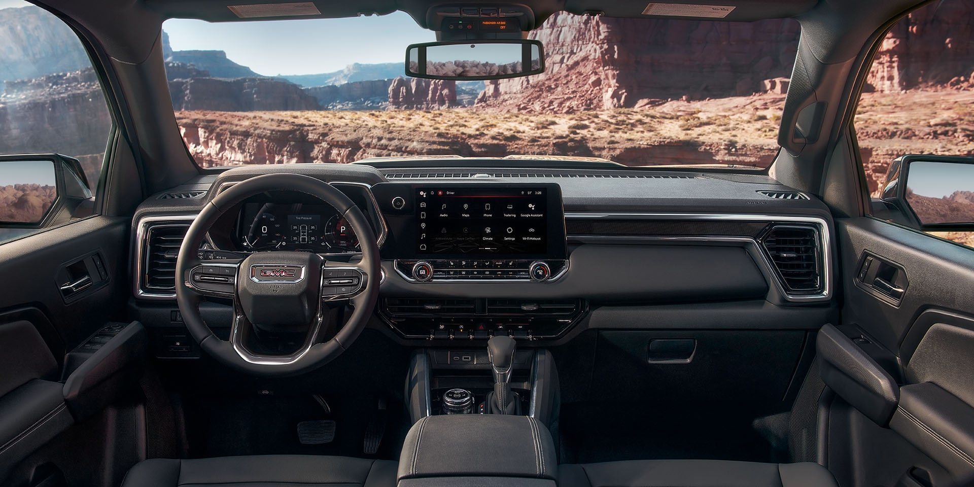  2024 GMC Canyon Denali interior dashboard with infotainment display. 