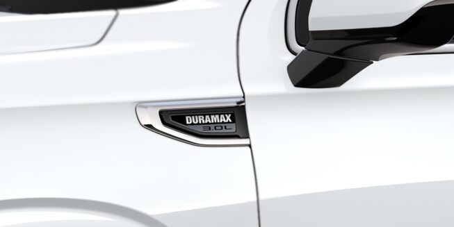 zoomed in view of the DURAMAX SLE YUKON 3.0L engine plaque