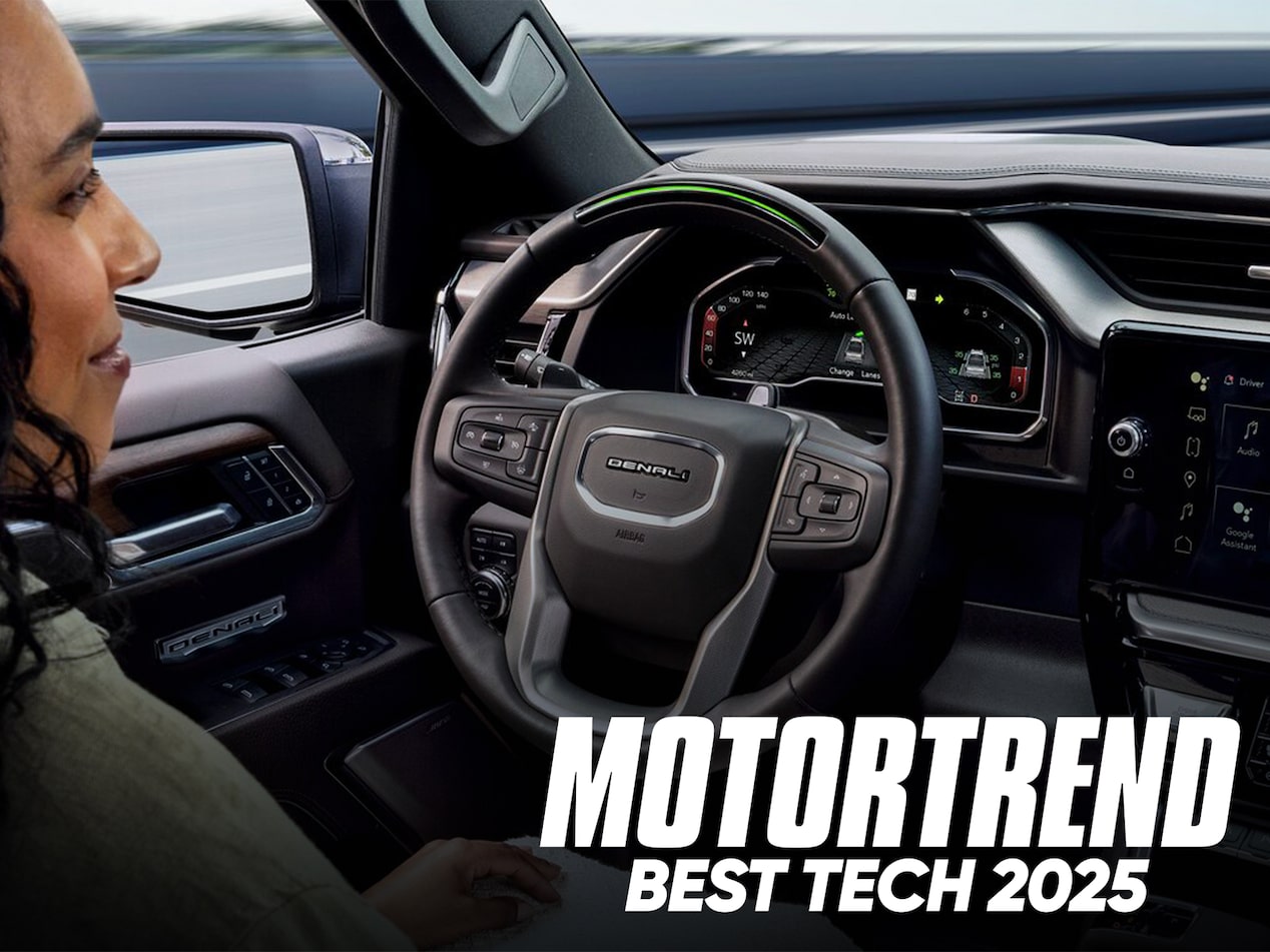 Over the Shoulder View of a Woman Using Super Cruise Hands-Free Technology in Her GMC with Text Overlay: MOTORTREND BEST TECH 2025