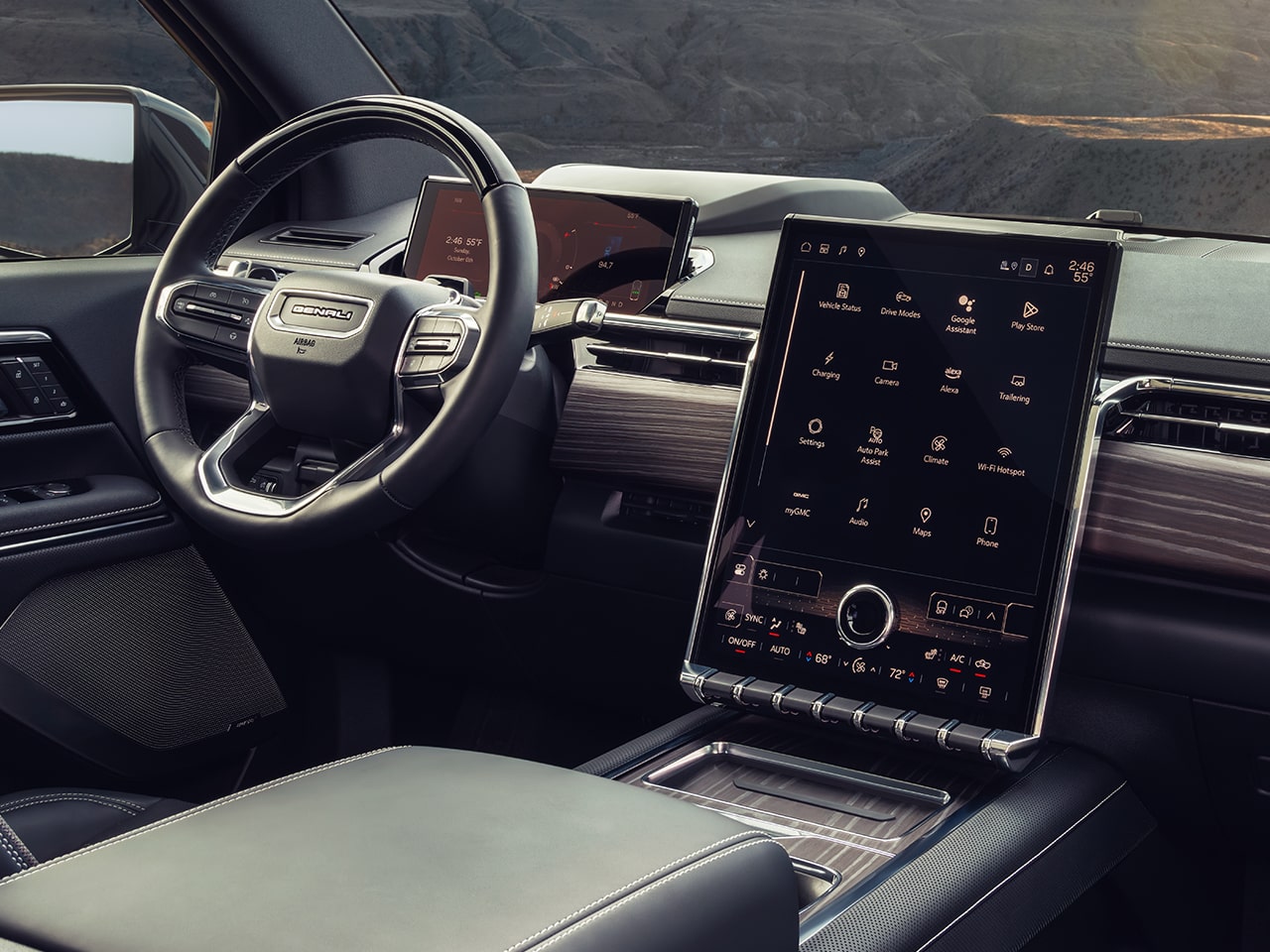 The Interior View of the Steering Wheel and Infotainment System in the GMC Sierra EV Pickup Truck