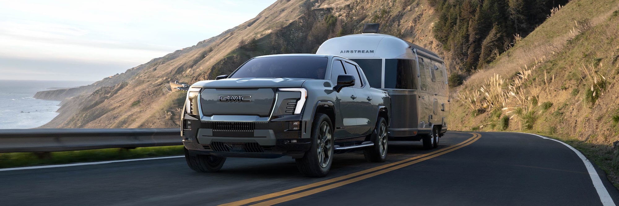 2025 GMC Sierra EV towing a trailer